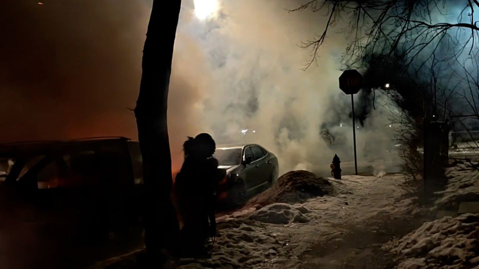 A family trying to get home from their son's basketball game in Minneapolis on Wednesday found themselves trapped in a protest and tear gassed in their car, resulting in the mother having to administer CPR to her infant. This screengrab from a video shared on social media shows the moment the family evacuated their car, fled into a nearby home and the state of the car in the aftermath. - Yaakov Strasberg/@YaakovStras