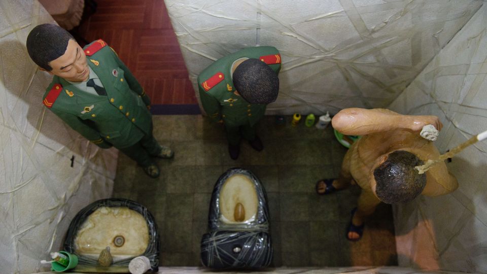 One of the six fiberglass dioramas of "S.A.C.R.E.D" (2012) depicting Ai's time while held by the Chinese government, recreated from the artist's memory. - LEON NEAL/AFP/AFP/Getty Images