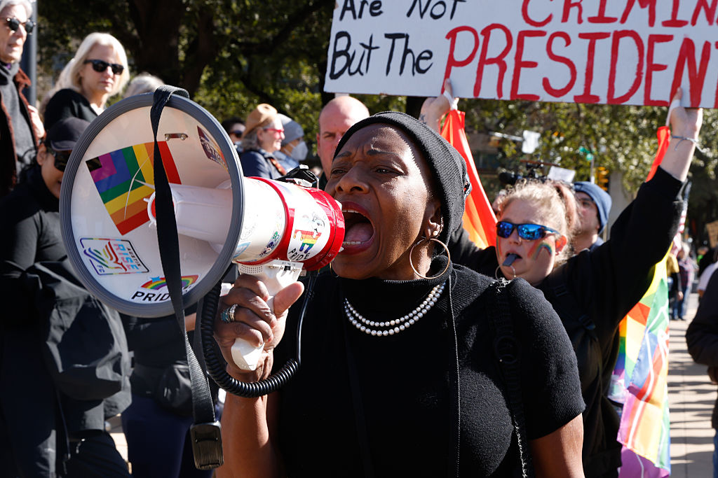 Joycelyn Henderson protests outside of Austin City Hall in Austin, Texas, on January 10, 2026, as hundreds gather to rally against ICE in the wake of the fatal shooting of Renee Nicole Good.<span class=