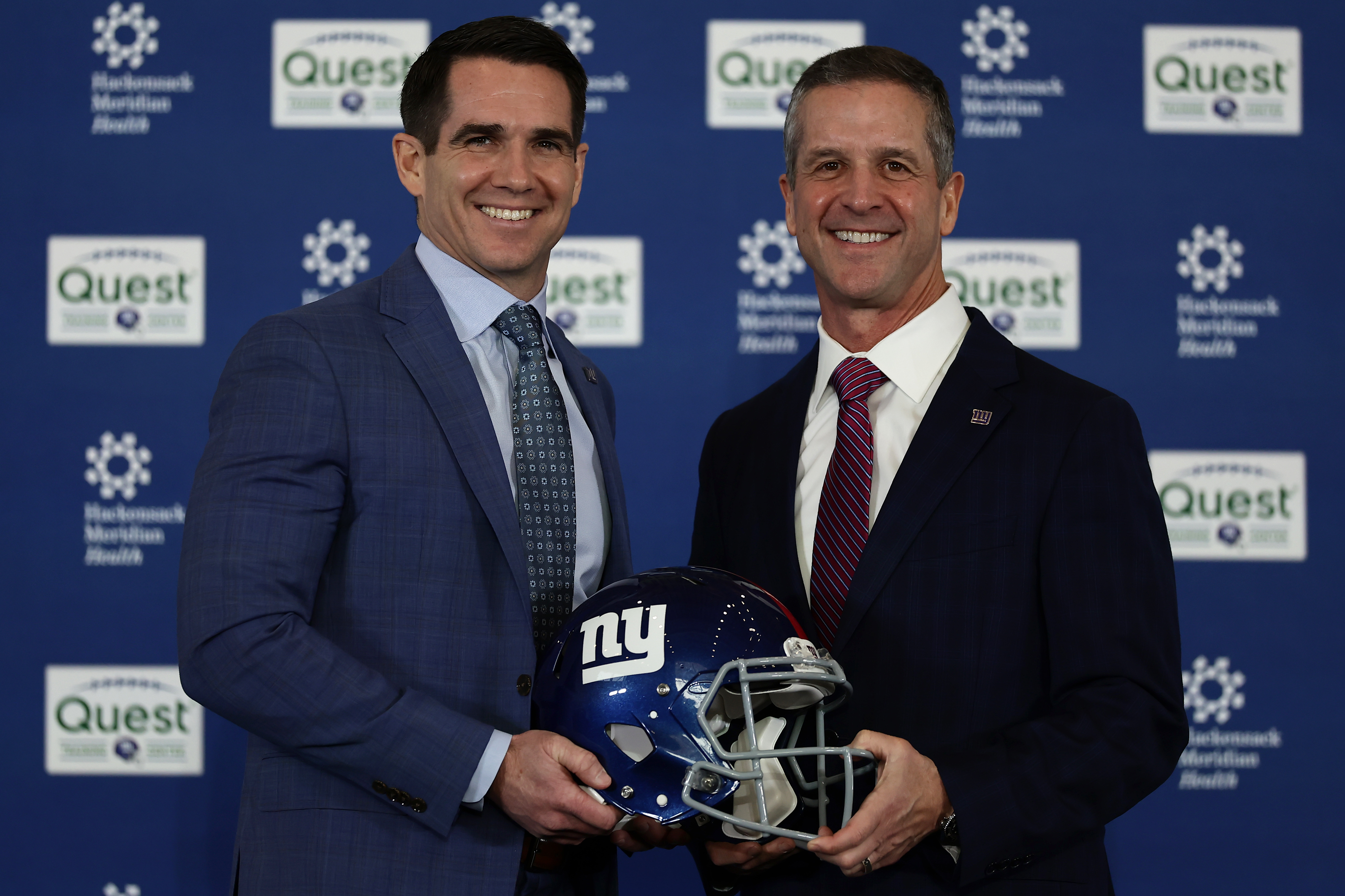 New York Giants head coach John Harbaugh, right, poses for a photo with general manager Joe Schoen after being introduced during a news conference at the teams NFL football training facility Tuesday, Jan. 20, 2026, in East Rutherford, N.J. (AP Photo/Adam Hunger)