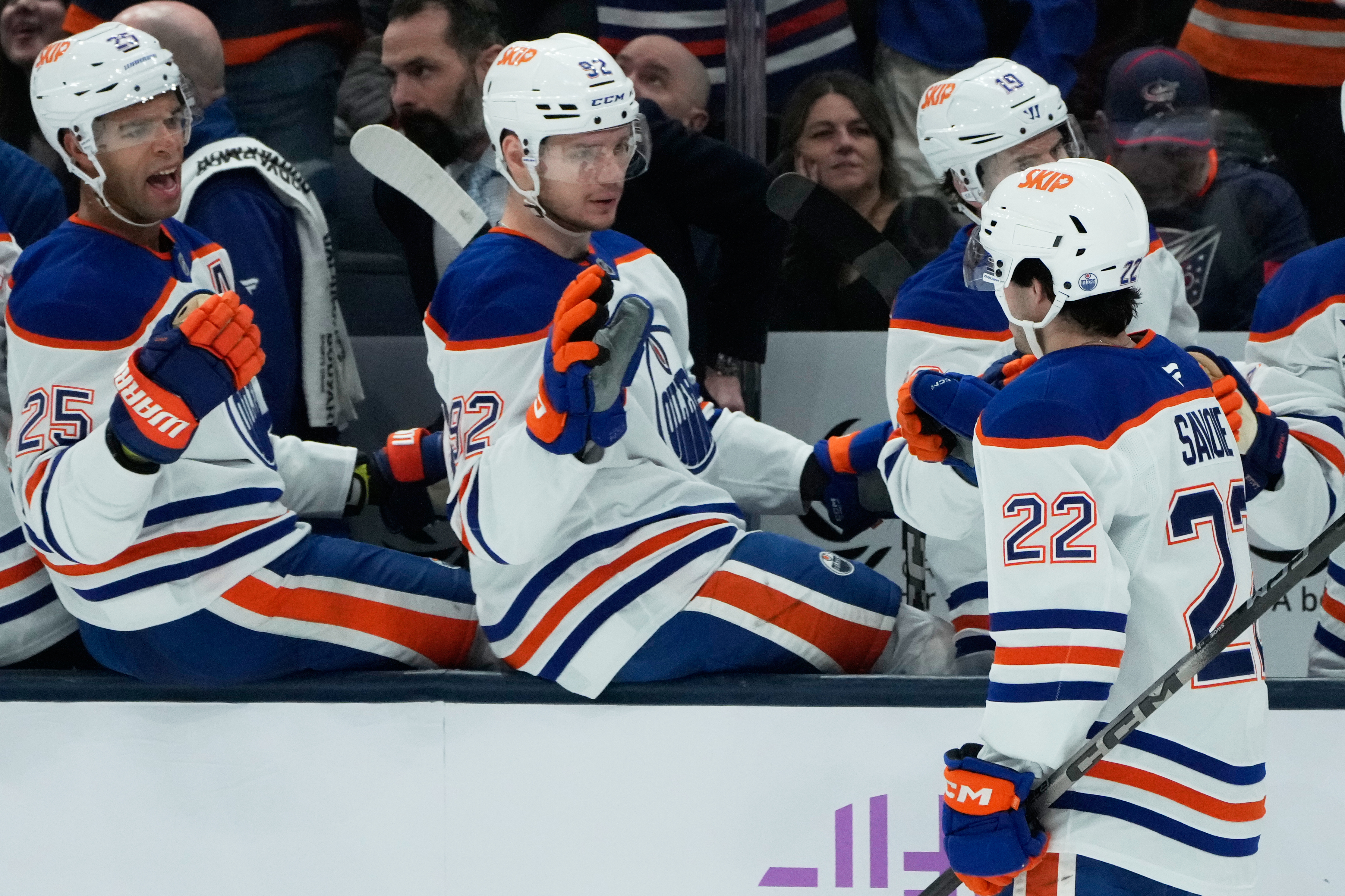Edmonton Oilers center Matt Savoie (22) is congratulated by teammates after his goal in the second period of an NHL hockey game against the Columbus Blue Jackets in Columbus, Thursday, Nov. 13, 2025. (AP Photo/Sue Ogrocki)