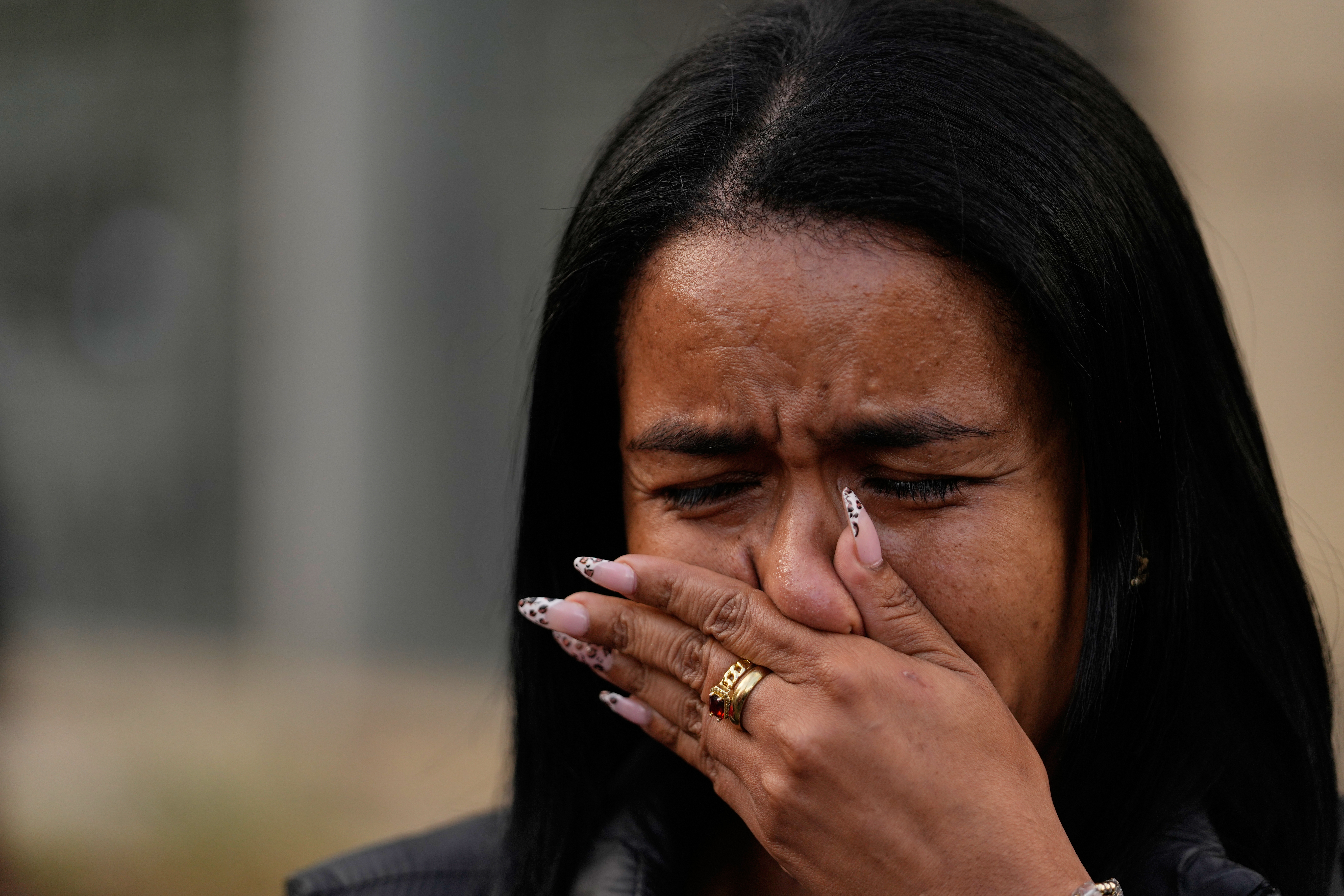 Narwin Gil cries as she waits for news of her detained sister, Marylyn Gil, outside El Helicoide, headquarters of Venezuela's intelligence service and a detention center, in Caracas, Venezuela, Saturday, Jan. 10, 2026. (AP Photo/Matias Delacroix)