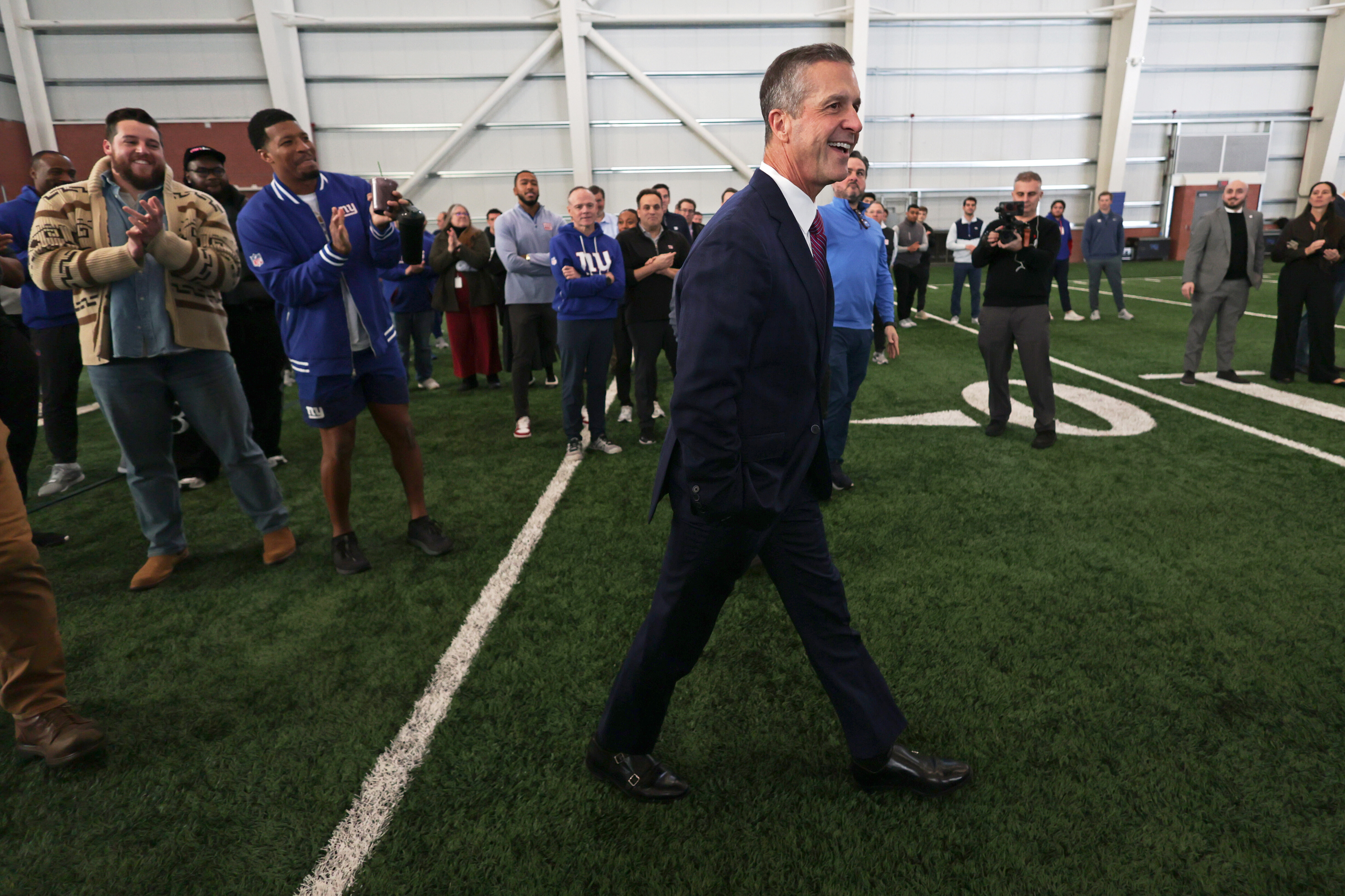 New York Giants head coach John Harbaugh arrives to to be introduced during a news conference at the teams NFL football training facility Tuesday, Jan. 20, 2026, in East Rutherford, N.J. (AP Photo/Adam Hunger) general manager Joe Schoen