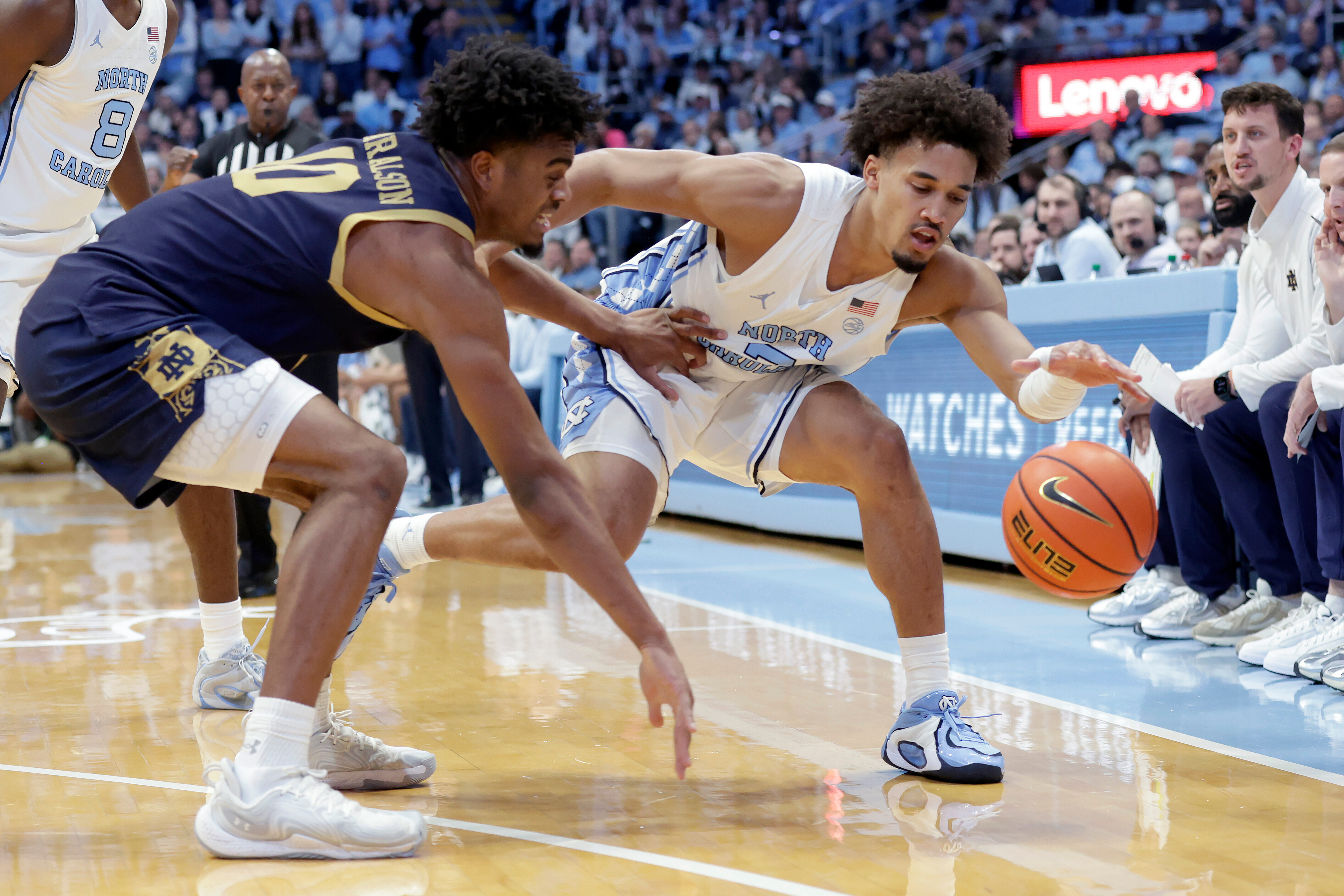 North Carolina guard Seth Trimble (7) tries to control the ball as he is defended by Notre Dame forward Jalen Haralson (10) during the first half of an NCAA college basketball game Wednesday, Jan. 21, 2026, in Chapel Hill, N.C. (AP Photo/Chris Seward)