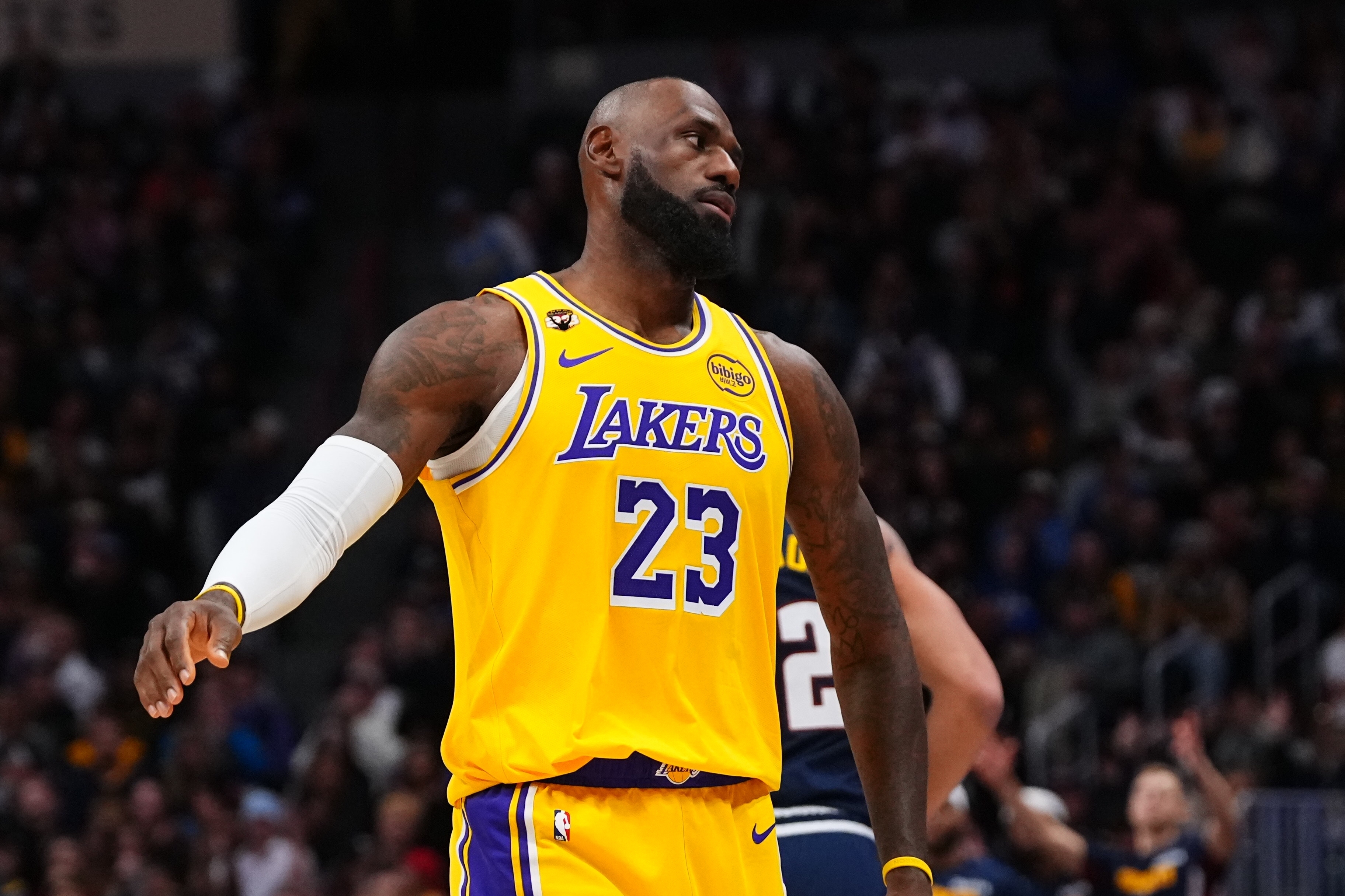 Los Angeles Lakers forward LeBron James (23) reacts to a Denver Nuggets three point basket during the second half of an NBA basketball game Tuesday, Jan. 20, 2026, in Denver. (AP Photo/Jack Dempsey)