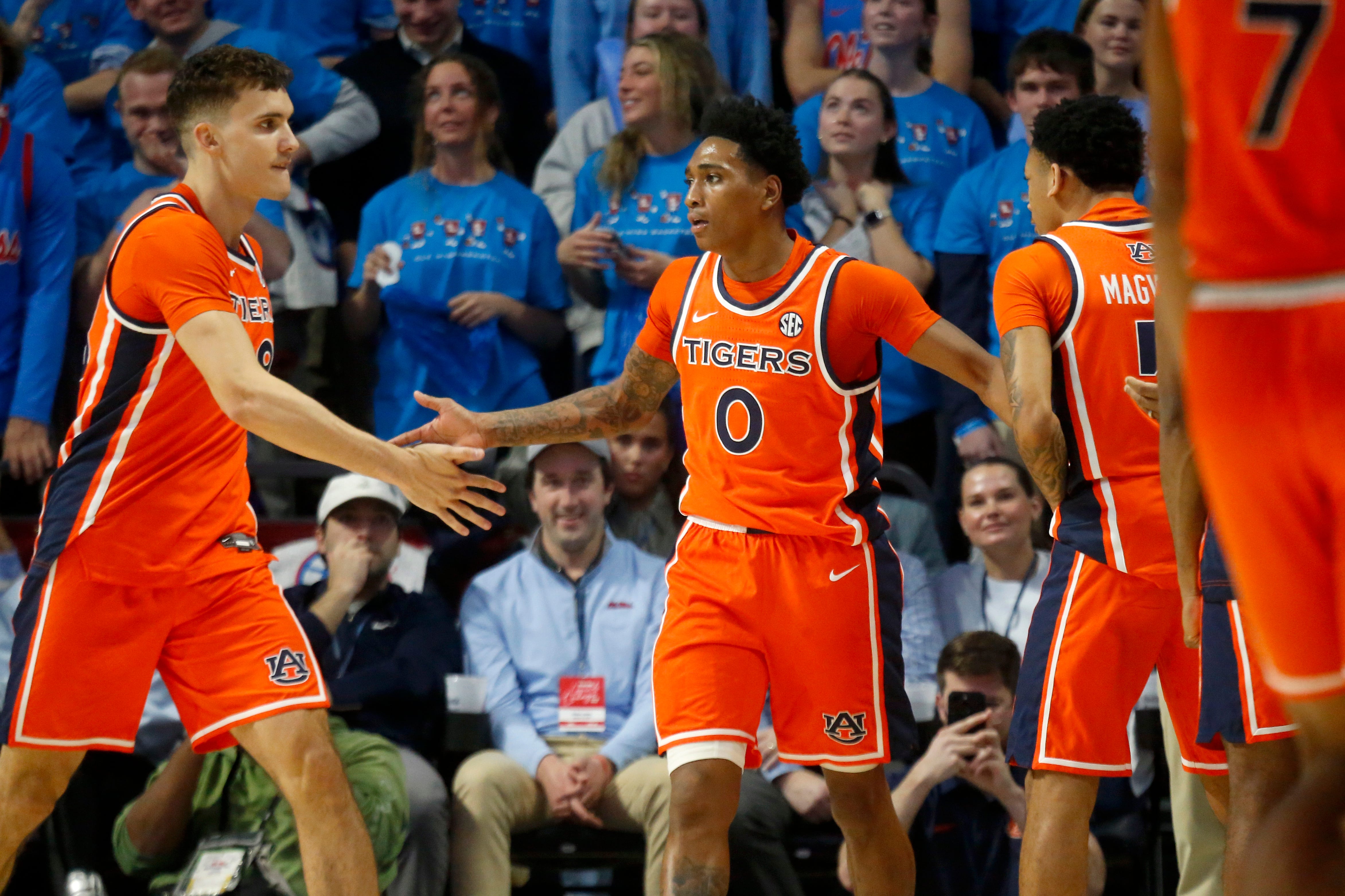 Jan 20, 2026; Oxford, Mississippi, USA; Auburn Tigers guard Tahaad Pettiford (0) reacts with forward Filip Jovic (38) and guard Kaden Magwood (5) during the second half against the Mississippi Rebels at The Sandy and John Black Pavilion at Ole Miss. Mandatory Credit: Petre Thomas-Imagn Images