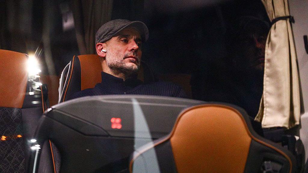 Pep Guardiola on the Man City team bus after defeat to Bodo/Glimt