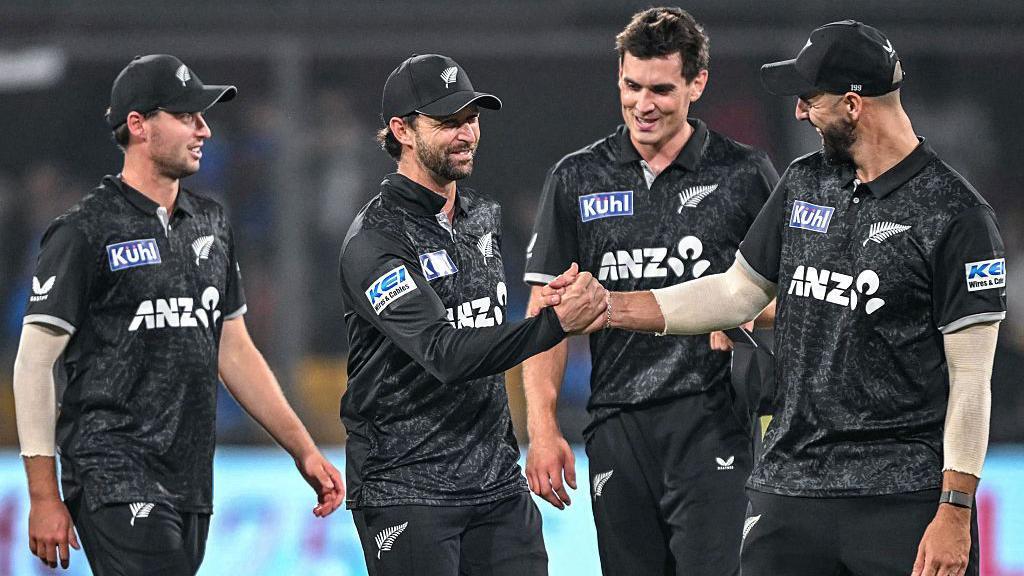 New Zealand players celebrate after winning the third one-day international against India to clinch the series