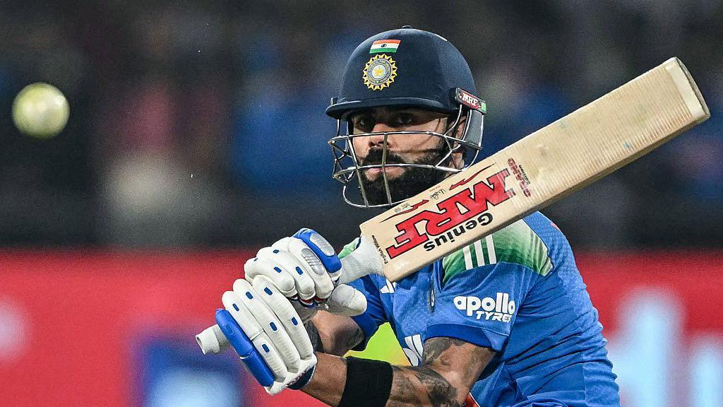 Virat Kohli whips the ball to the leg side during his 124 in India's defeat by New Zealand in Indore
