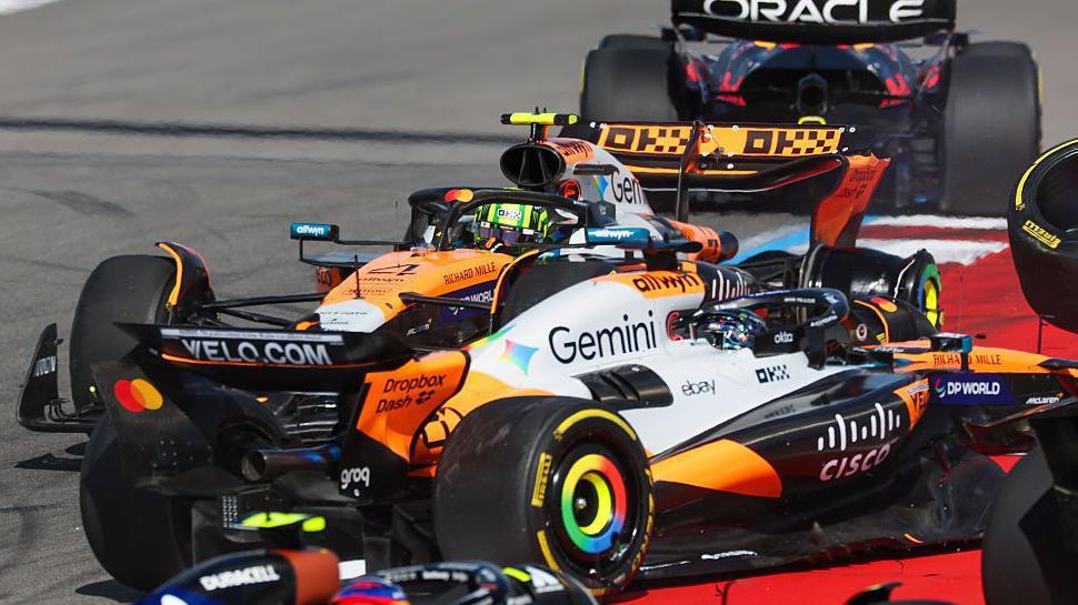 Lando Norris and Oscar Piastri after colliding at the United States Grand Prix