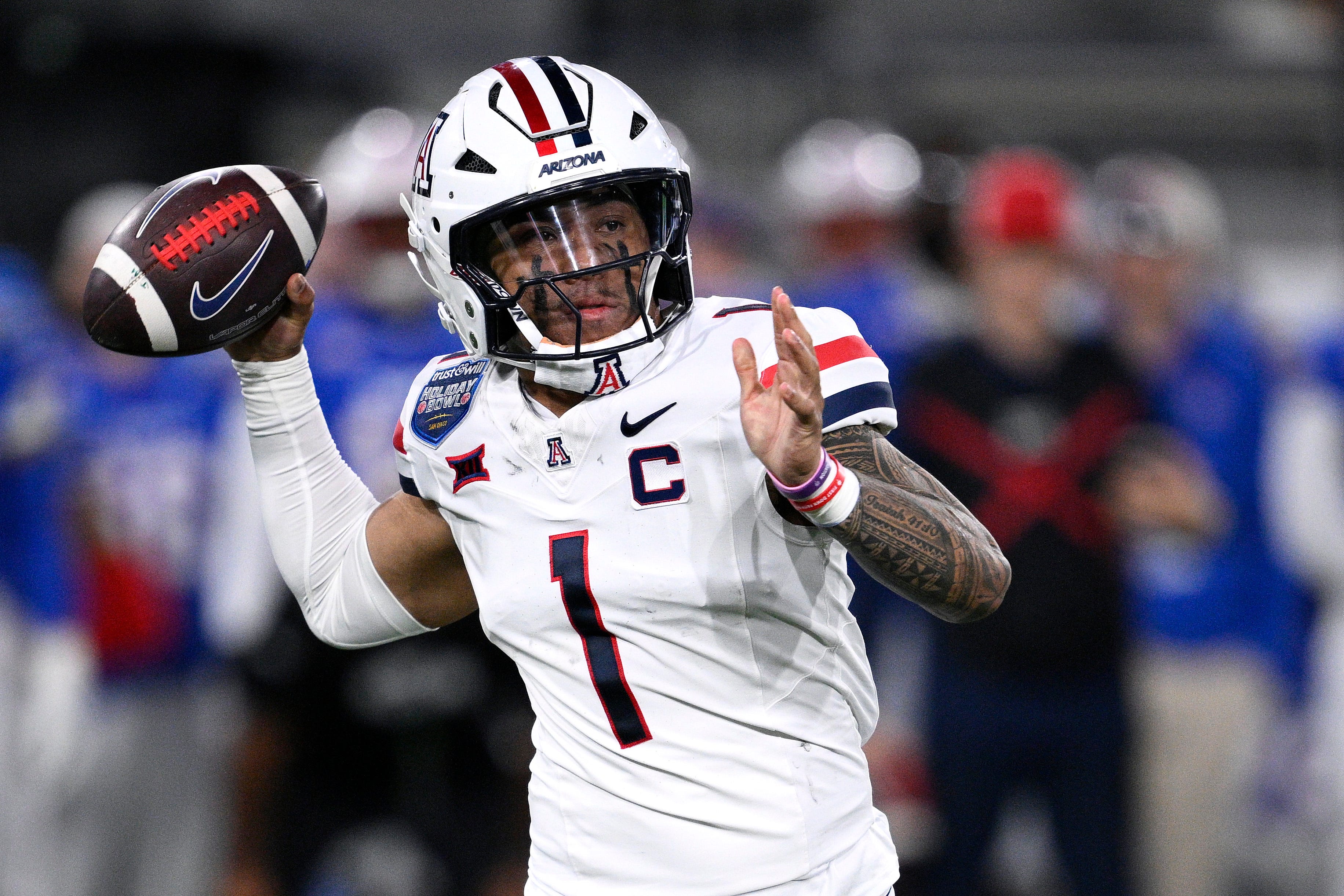 Noah Fifita #1 of the Arizona Wildcats throws a pass during the first half of the Trust & Will Holiday Bowl game at Snapdragon Stadium on Jan. 2, 2026 in San Diego.