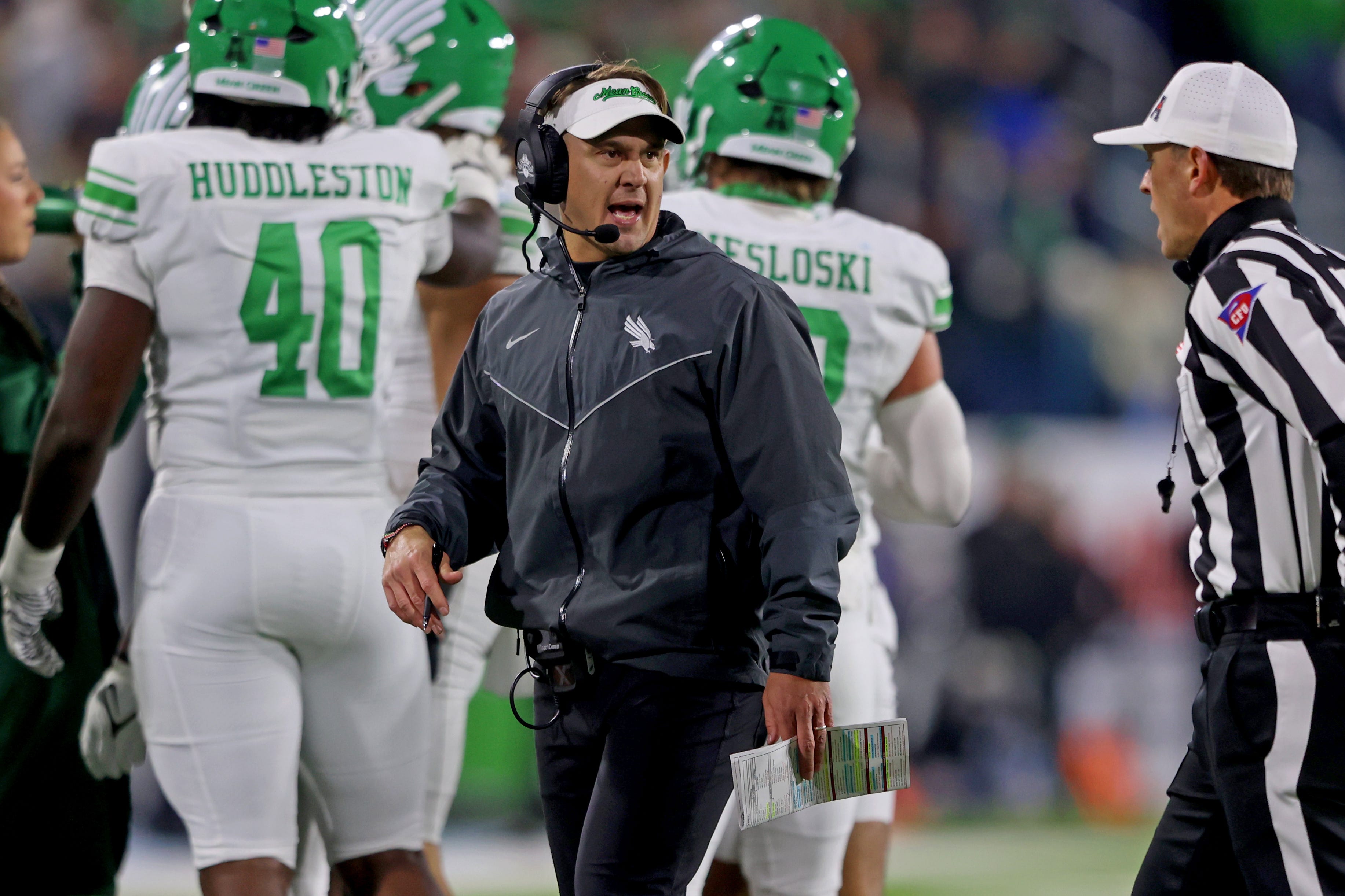 NEW ORLEANS, LOUISIANA - DECEMBER 05: Head coach Eric Morris of the North Texas Mean Green talks to an official during the 2025 American Conference Football Championship against the Tulane Green Wave at Yulman Stadium on December 5, 2025 in New Orleans, Louisiana. (Photo by Michael DeMocker/Getty Images)