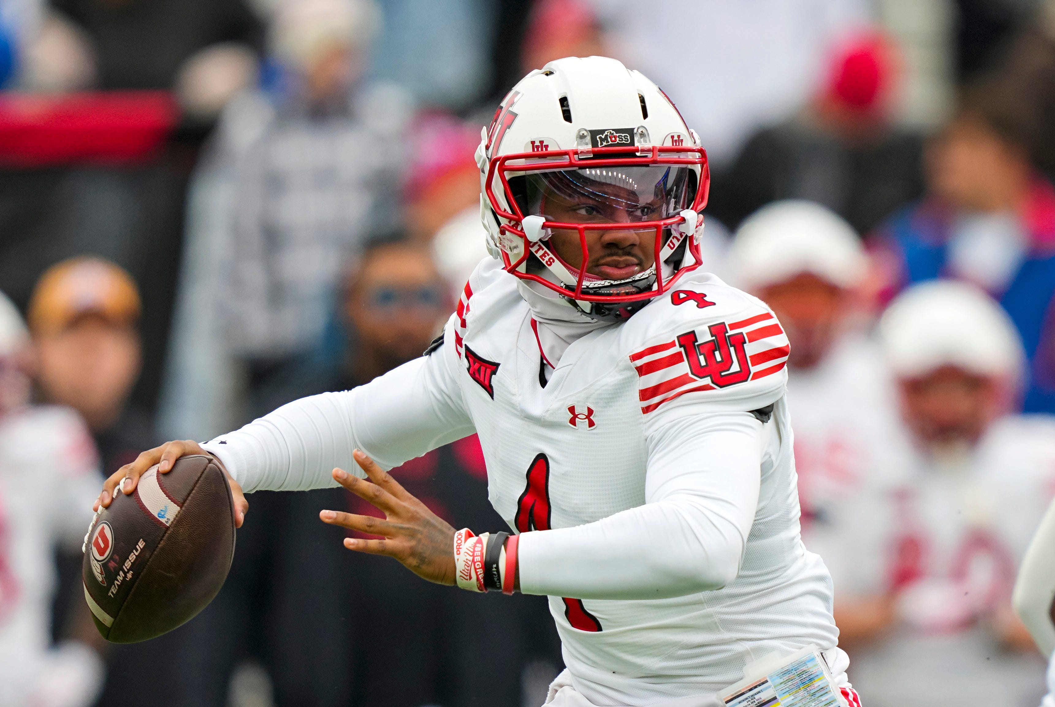 Utah Utes quarterback Devon Dampier (4) throws a pass during the first half against the Kansas Jayhawks at David Booth Kansas Memorial Stadium in Lawrence, Kansas.