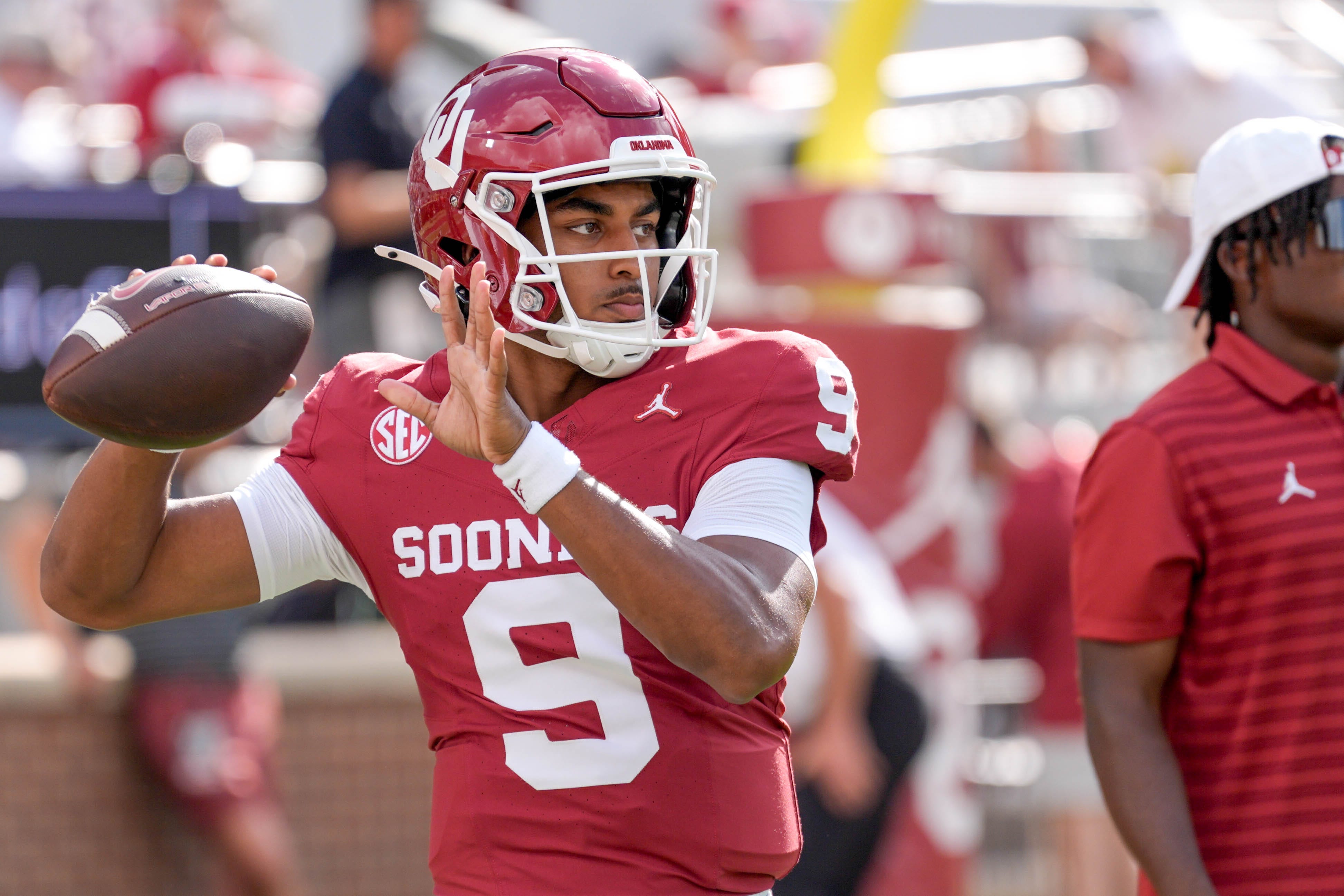 Oklahoma quarterback Michael Hawkins Jr. (9) warms up before an NCAA football game between Oklahoma (OU) and Temple at the Gaylord Family Oklahoma Memorial Stadium in Norman, Okla., on Friday, Aug. 30, 2024.