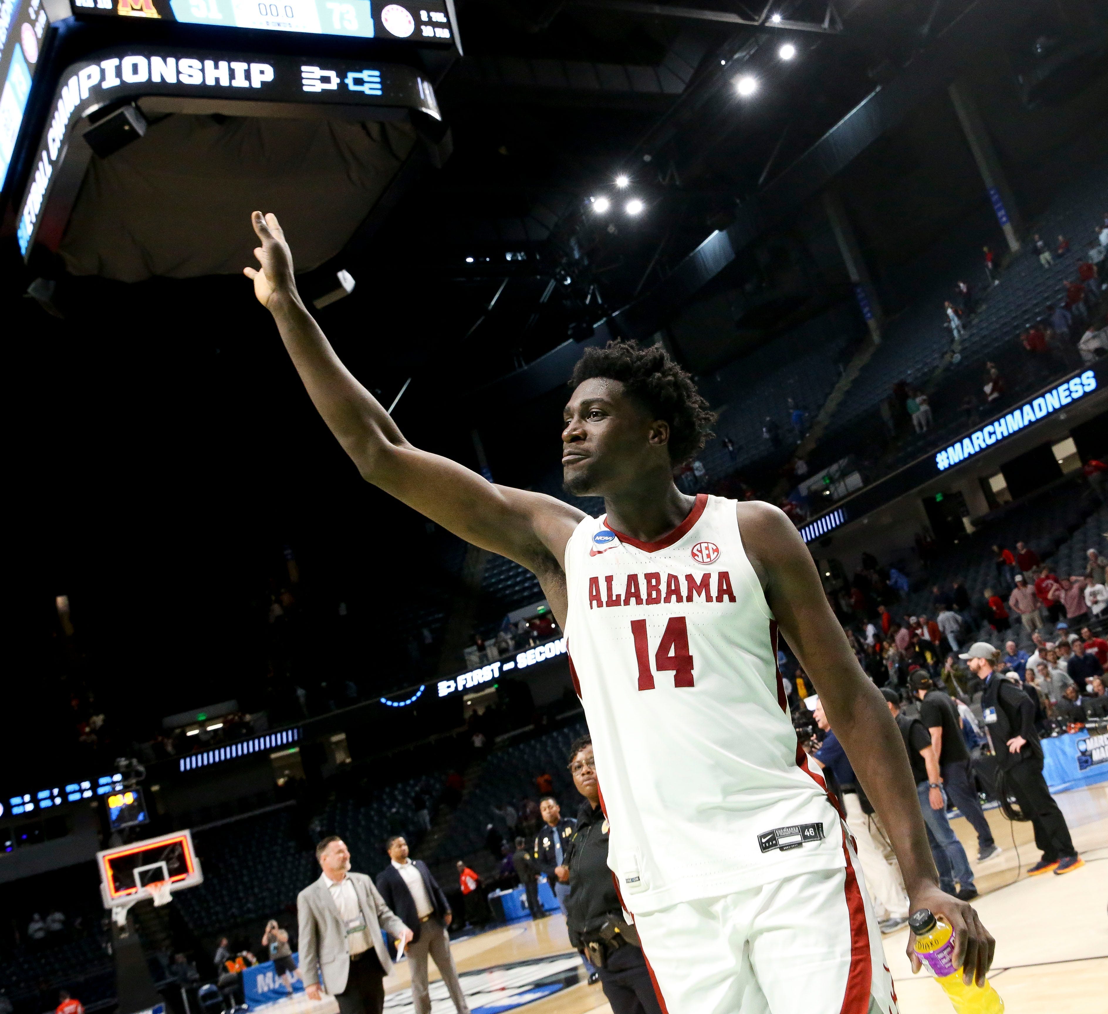 Alabama center Charles Bediako (14) gestures as he leaves the court at Legacy Arena in Birmingham, Alabama, during the second round of the NCAA Tournament on March 18, 2023.