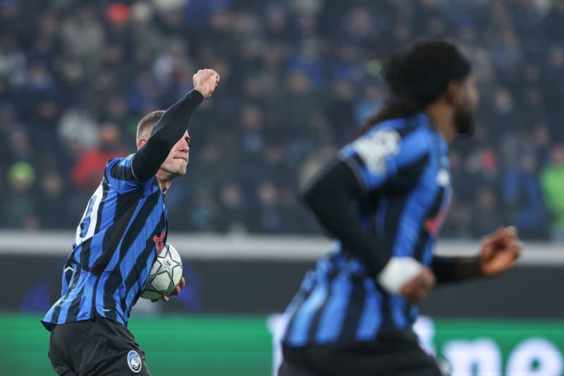 Atalanta's Nikola Krstovic celebrates scoring his side's second goal during the UEFA Champions League soccer match between Atalanta BC and Athletic Club Bilbao at the New Balance Arena. Stefano Nicoli/LaPresse via ZUMA Press/dpa