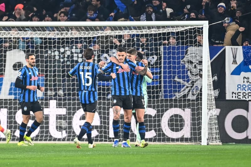 Atalanta's Gianluca Scamacca (2nd R) celebrates scoring his side's first goal with teammates during the UEFA Champions League soccer match between Atalanta BC and Athletic Club Bilbao at the New Balance Arena. Gianluca Ricci/LiveMedia-IPA/ZUMA Press Wire/dpa