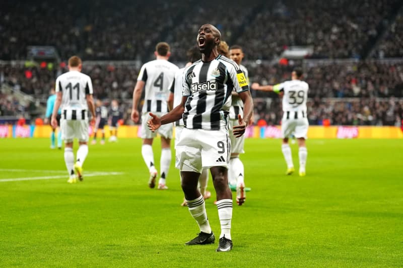 Newcastle United's Yoane Wissa celebrates scoring his side's first goal during the UEFA Champions League soccer match between Newcastle United and PSV Eindhoven at St James' Park. Owen Humphreys/PA Wire/dpa