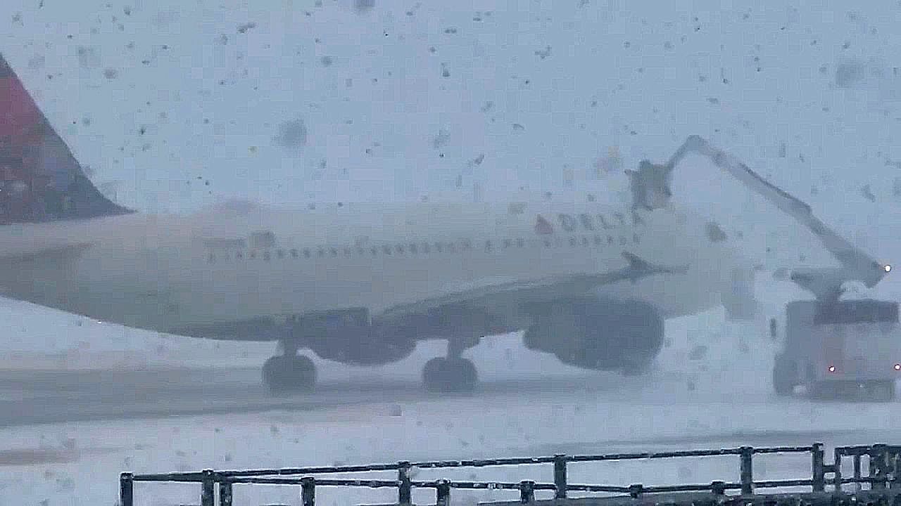 Snow squall turns New York airport into whiteout within minutes. 