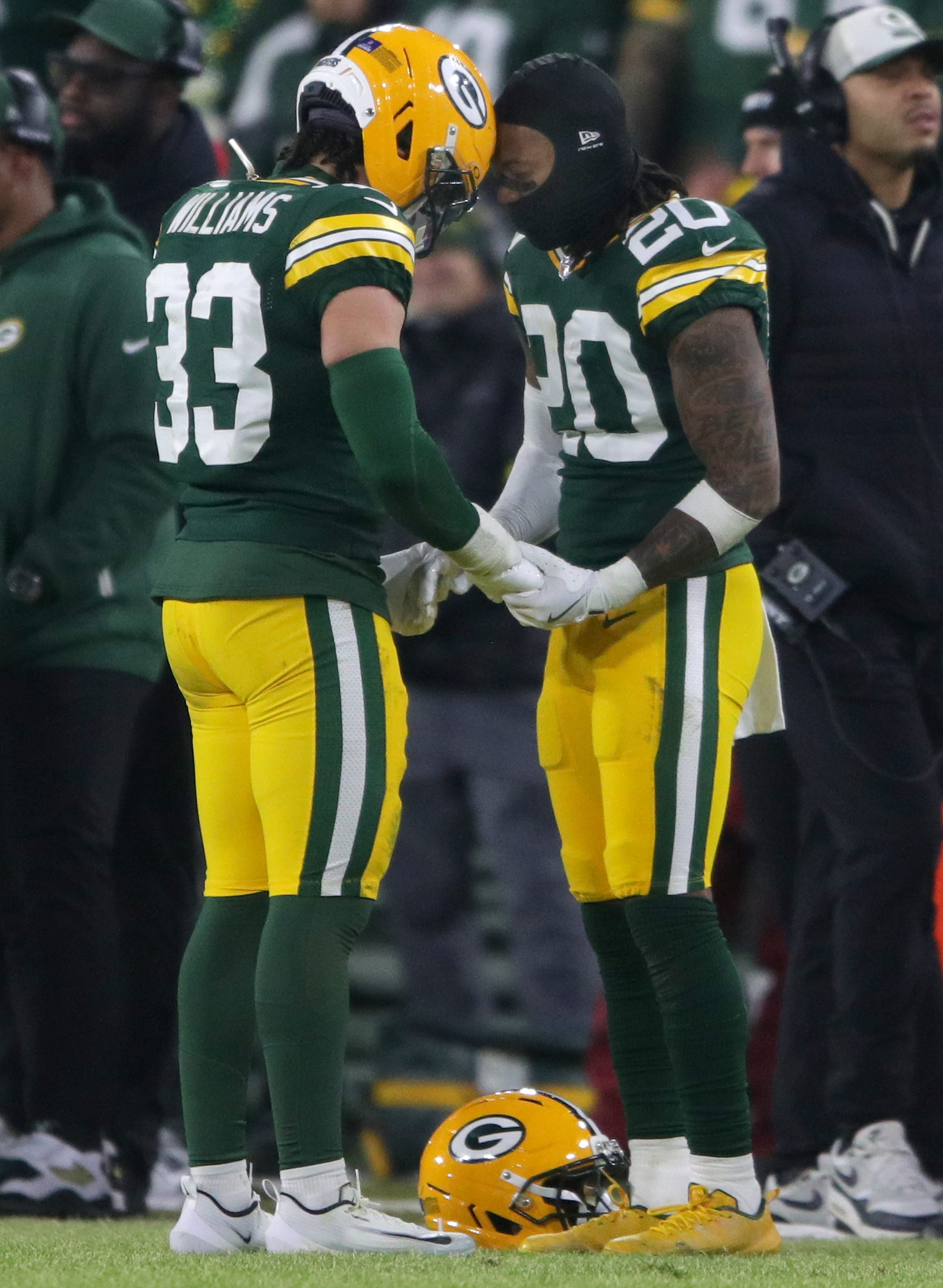 Packers safety Evan Williams (33) and safety Javon Bullard (20) take a moment following an injury to cornerback Kamal Hadden (36) on Dec. 27 against the Ravens.