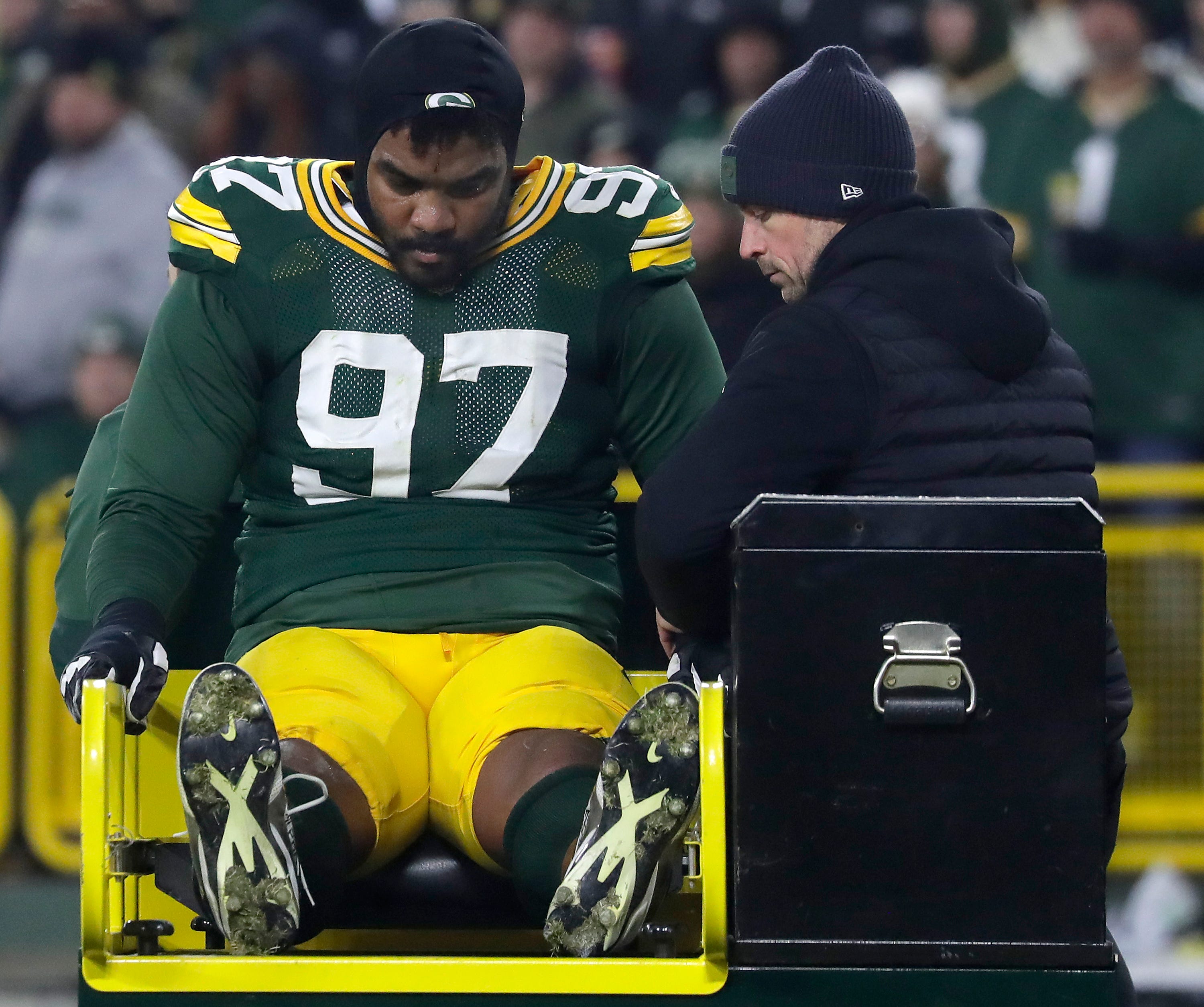 Packers defensive tackle Jordon Riley is carted off Lambeau Field with an Achilles injury Dec. 27 against the Ravens.
