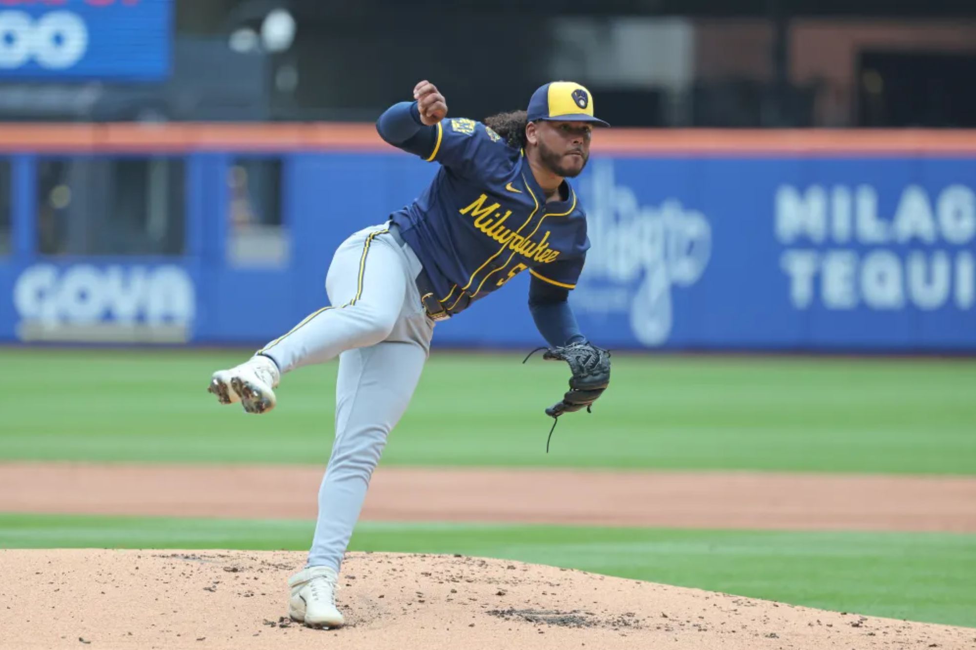 An image collage containing 1 images, Image 1 shows Freddy Peralta #51 of the Milwaukee Brewers throws a pitch during the first inning