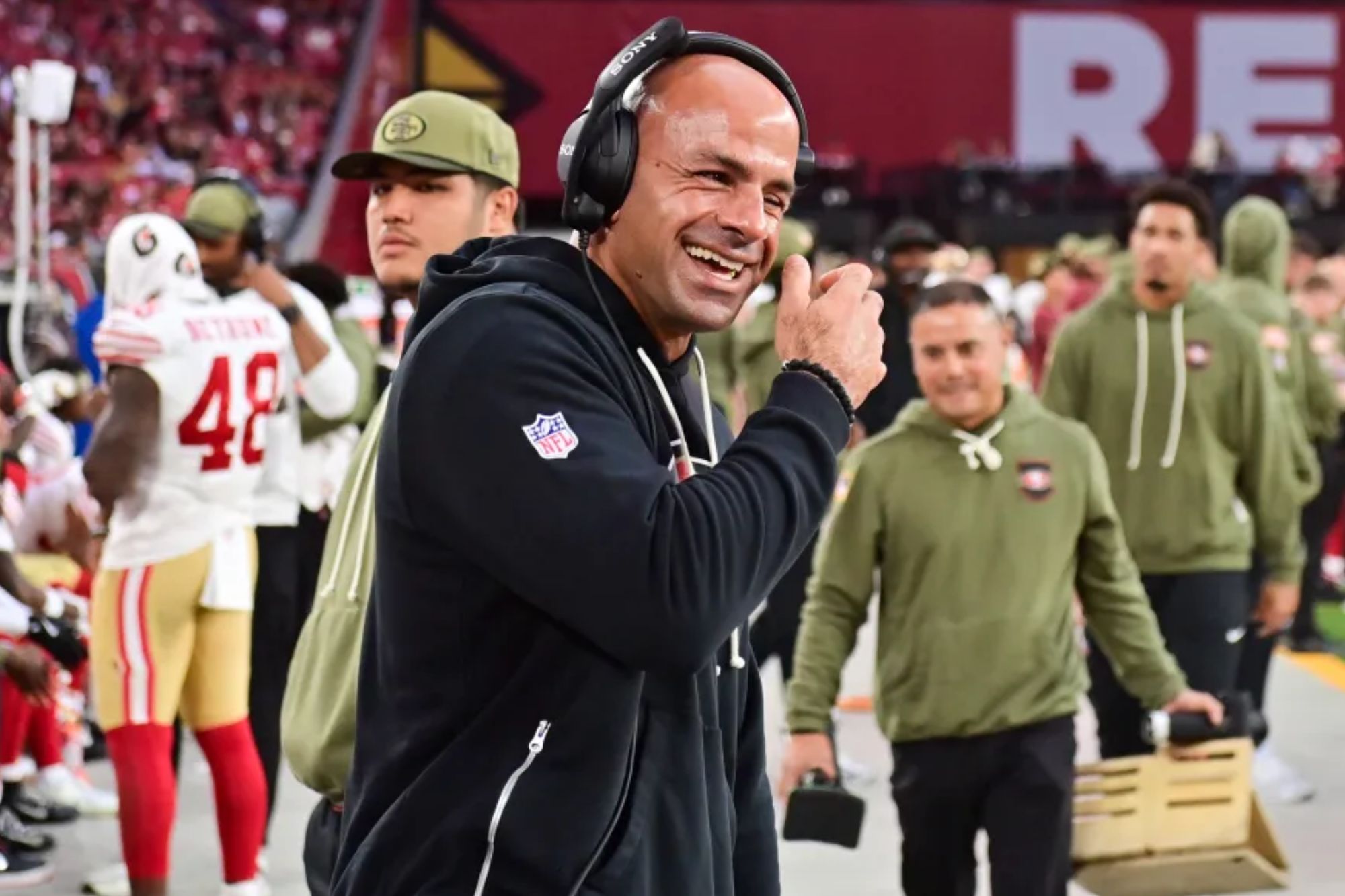 An image collage containing 1 images, Image 1 shows San Francisco 49ers defensive coordinator Robert Saleh reacts to a play