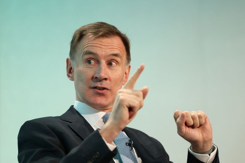 UK's Hunt to cut social security rates in budget, The Times reports