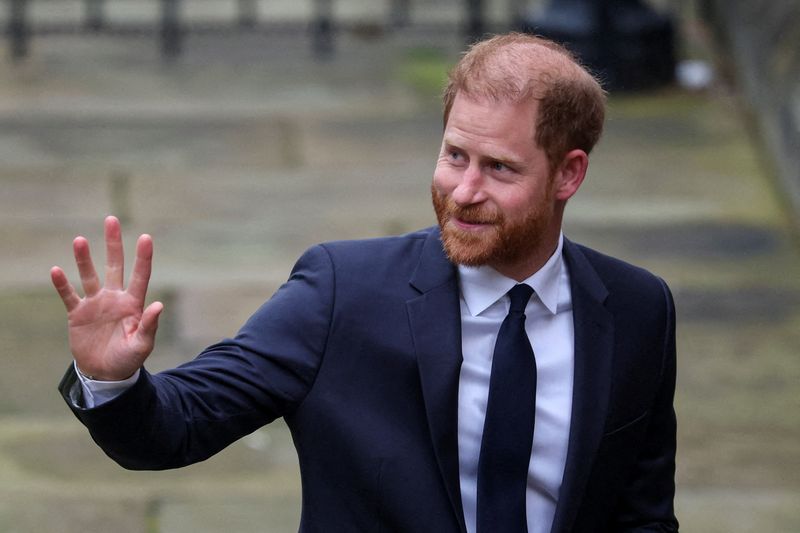Britain's Prince Harry waves as he arrives to attend the start of the nine-week trial lawsuit against Associated Newspapers, publisher of the Daily Mail, which Britain's Prince Harry and others are suing over allegations of privacy breaches dating back 30 years, at the High Court in London, Britain. REUTERS/Isabel Infantes