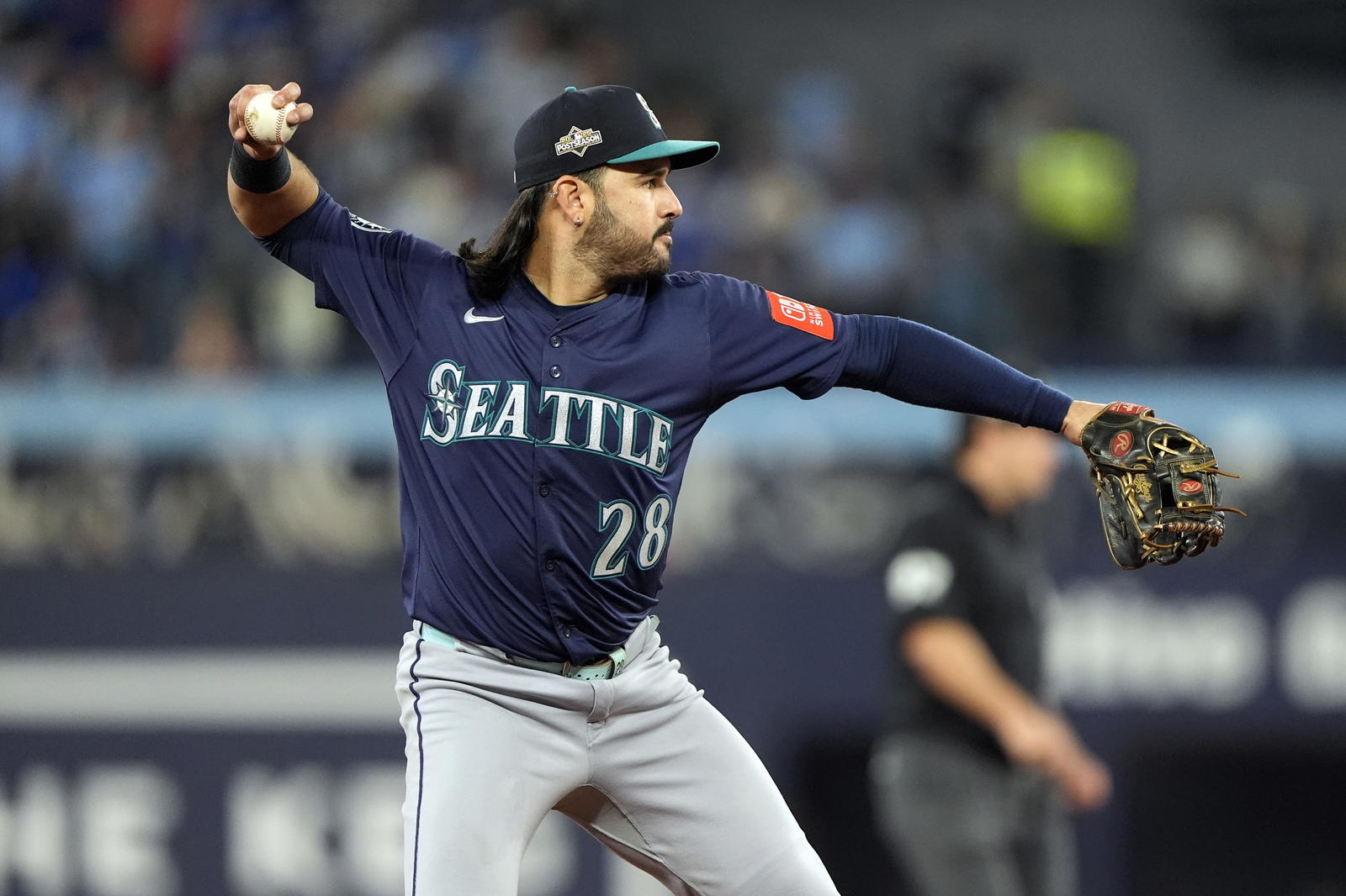 Oct 20, 2025; Toronto, Ontario, CAN; Seattle Mariners third baseman Eugenio Suarez (28) throws out Toronto Blue Jays right fielder George Springer (4) at first base in the second inning during game seven of the ALCS round for the 2025 MLB playoffs at Rogers Centre. (John E. Sokolowski/Imagn Images)