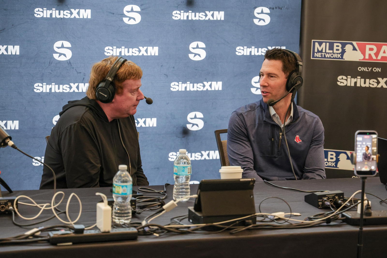 Dec 10, 2025; Orlando, FL, USA; Boston Red Sox Chief Baseball Officer Craig Breslow (right) during an interview at the 2025 MLB Winter Meetings at Signia by Hilton Hotel. (Mike Watters/Imagn Images)