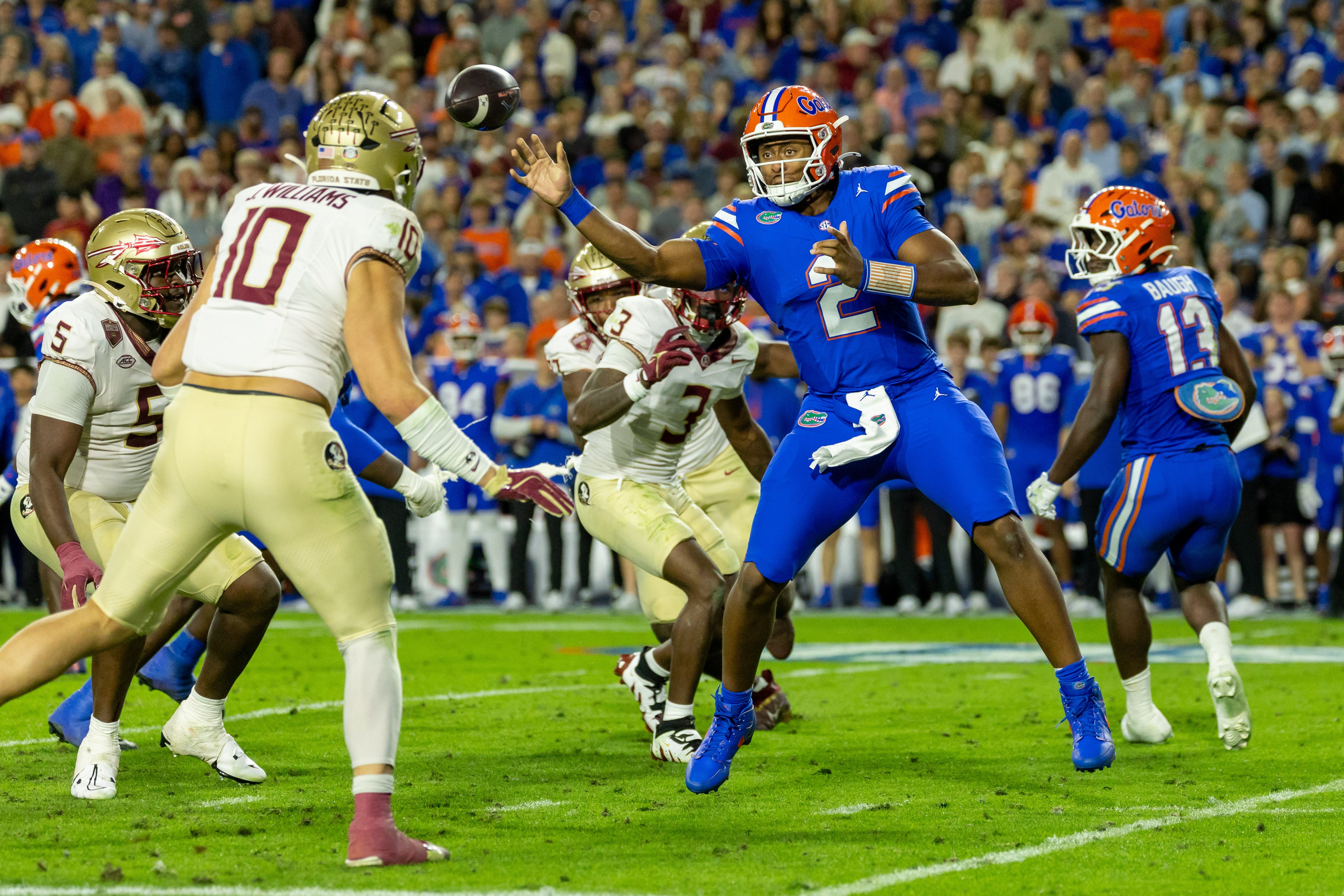 Nov 29, 2025; Gainesville, Florida, USA; Florida Gators quarterback DJ Lagway (2) throws a pass during the second quarter against the Florida State Seminoles at Ben Hill Griffin Stadium. Mandatory Credit: Bob Kupbens-Imagn Images