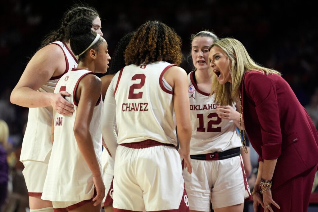 Oklahoma coach Jennie Baranczyk talks with players