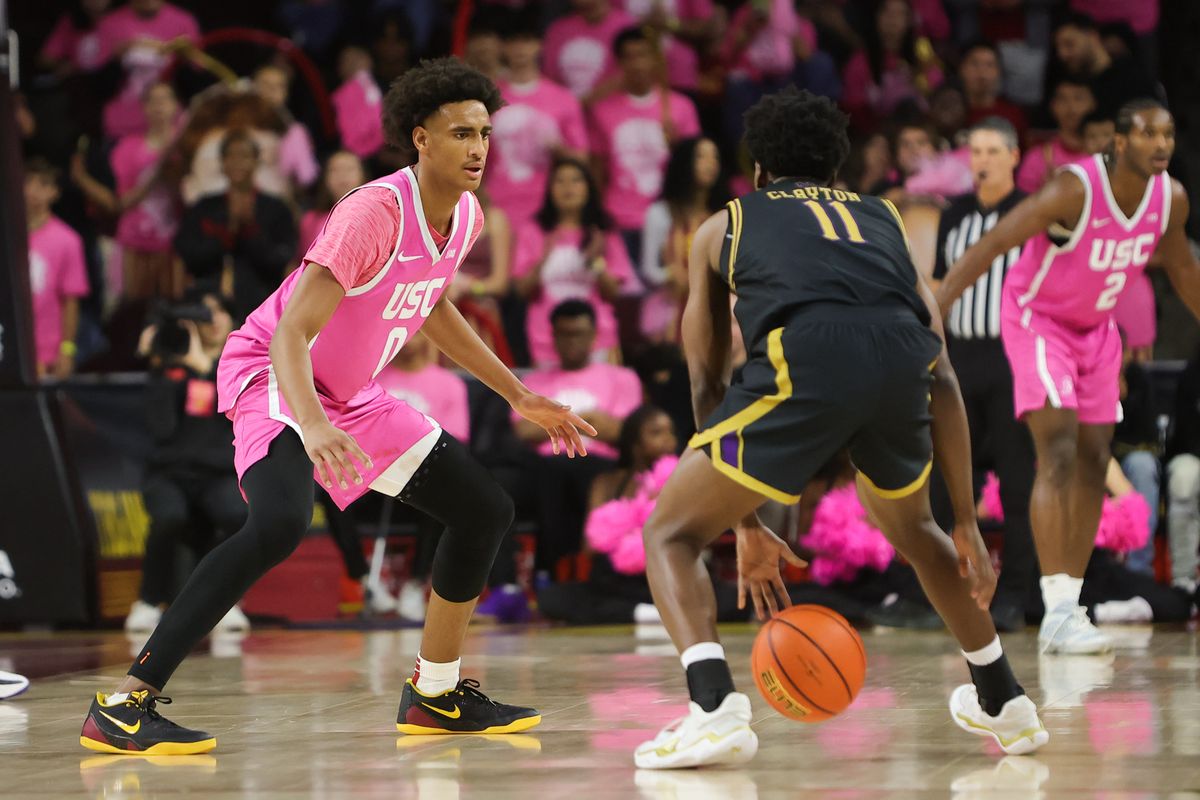 USC guard Alijah Arenas (0) defends Northwestern guard Jordan Clayton (11) during an NCAA basketball game on January 21, 2026 in Los Angeles, CA.