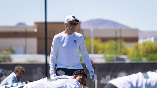 Las Vegas Raiders head coach Pete Carroll walks by his players as they stretch before the Raiders’ rookie mini camp, Friday May 9, 2025 in Las Vegas, Nev.