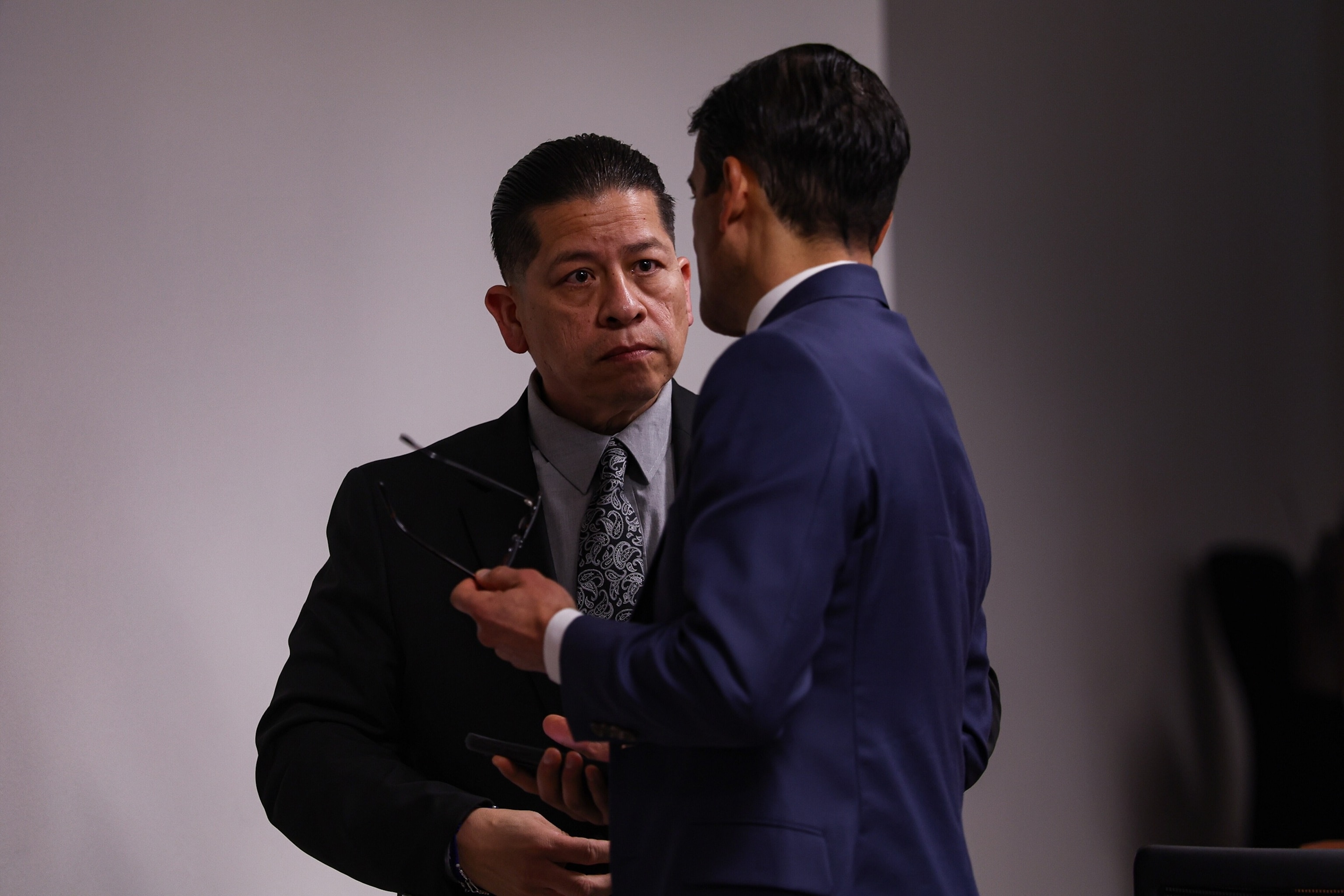 Sam Owens/The San Antonio Express-News via AP - PHOTO: Former Uvalde school district police officer Adrian Gonzales, left, talks to his defense attorney Nico LaHood during a break on the 10th day of his trial at Nueces County Courthouse in Corpus Christi, Texas, Tuesday, Jan. 20, 2026.