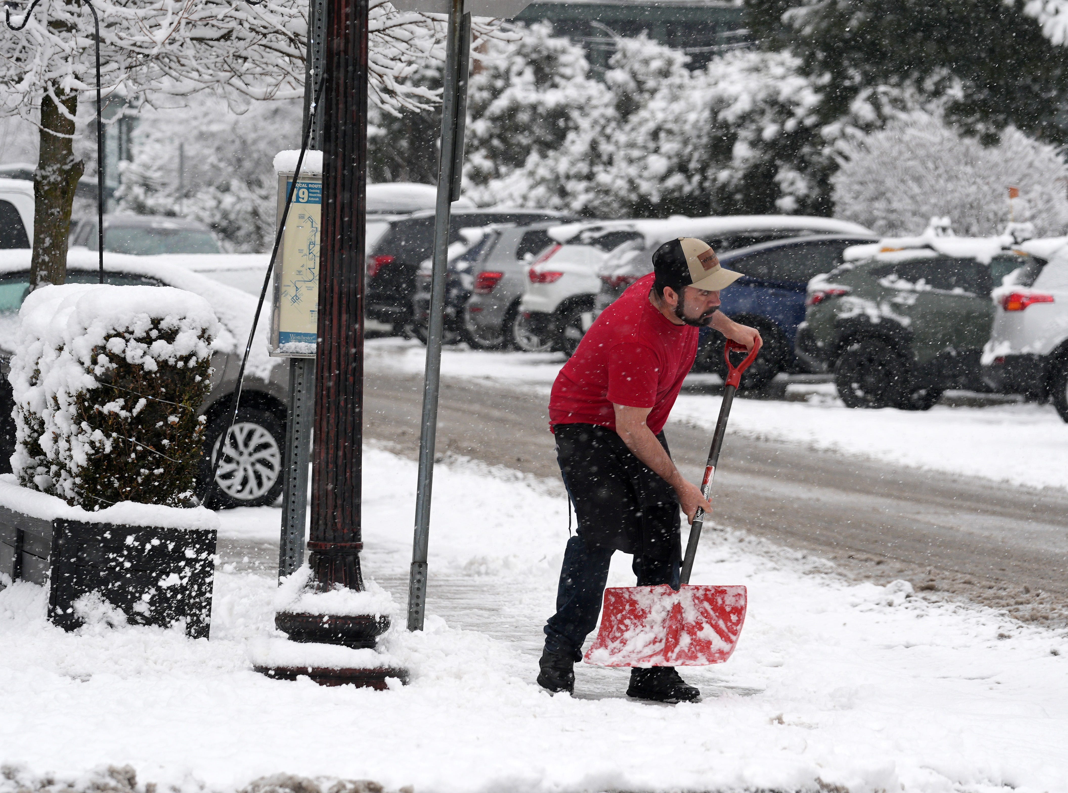 A workers clearing snow on a sidewalk along Katonah Ave in downtown Katonah, NY on Jan. 17, 2026.