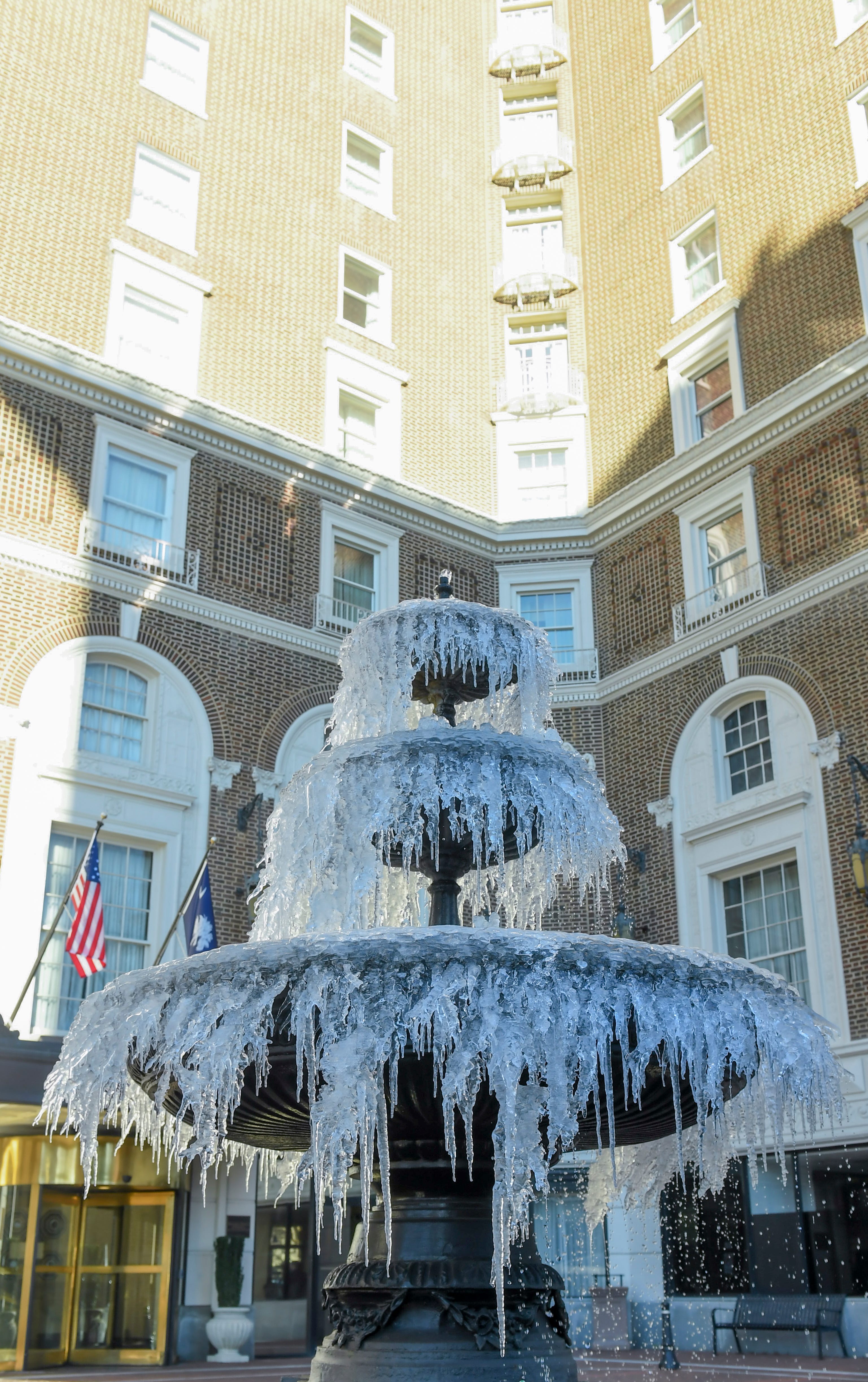 Ice collects on the fountain Friday, Jan. 16, 2026, at the Westin Poinsett Hotel in Greenville, South Carolina. The Upstate is expected to see freezing temperatures and the possibility of snow over the weekend.