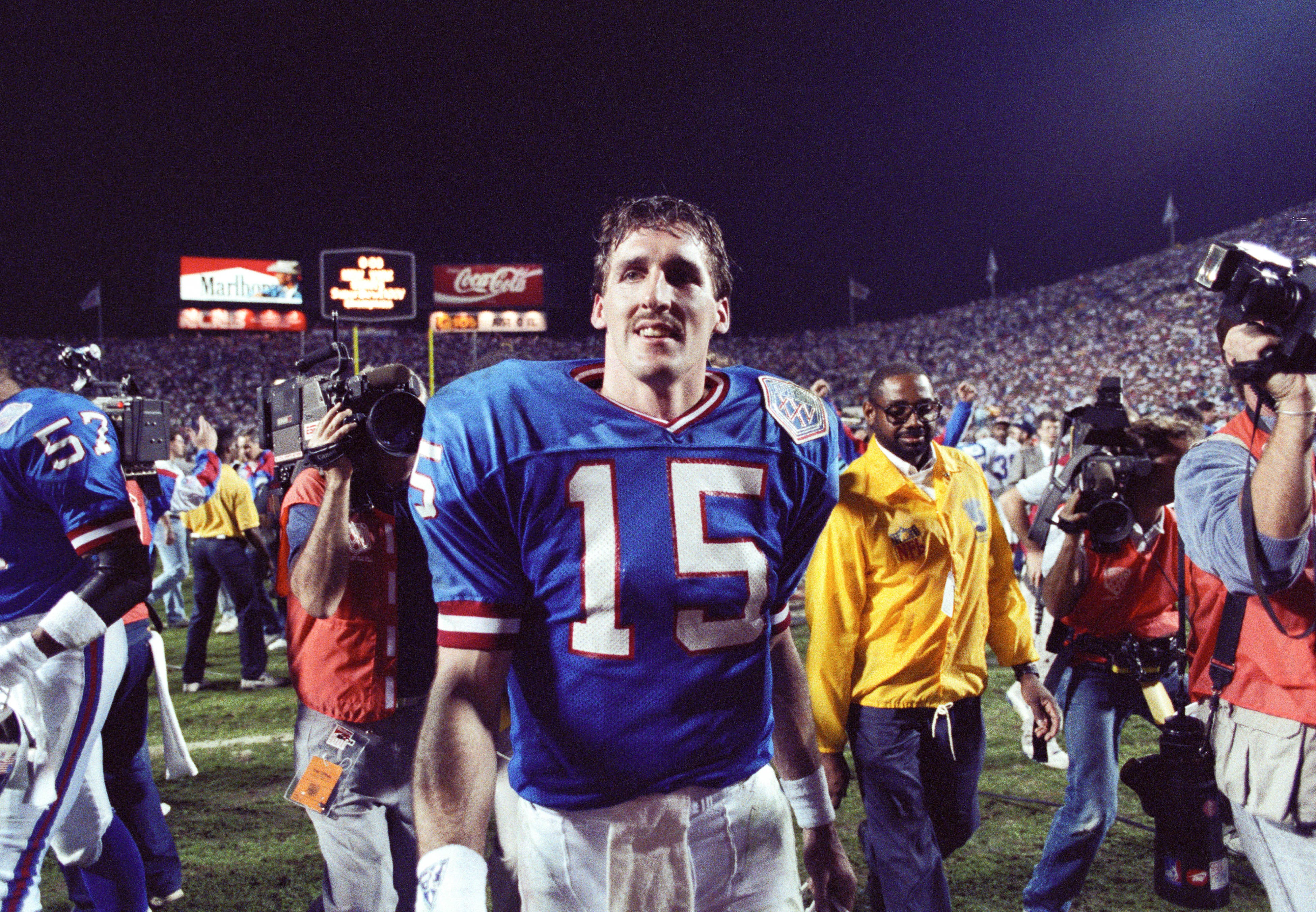 Giants quarterback Jeff Hostetler (15) soaks in victory on the field after Super Bowl XXV at Tampa Stadium in Tampa, Florida on Jan. 27, 1991.
